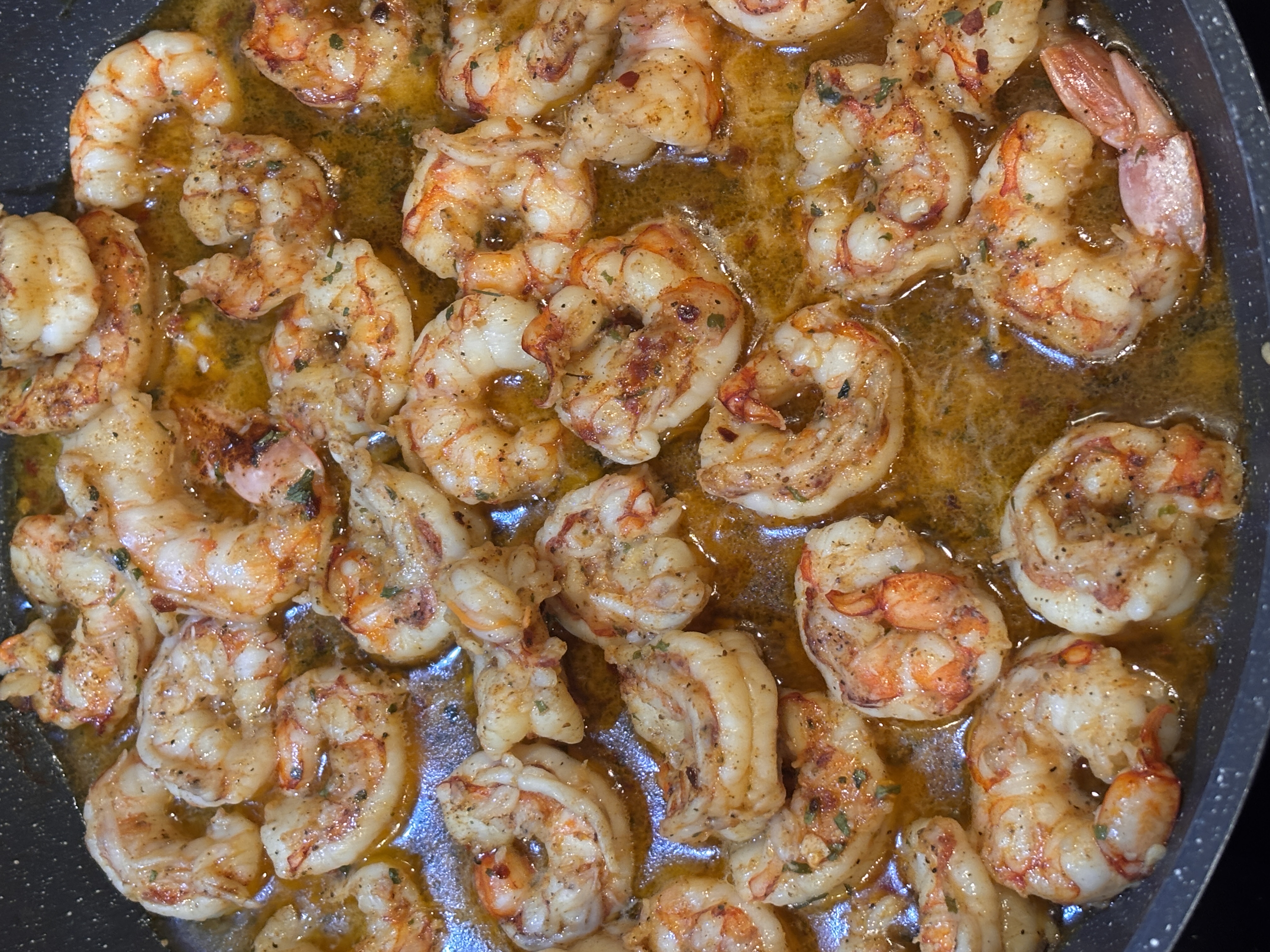 Skillet of buttery garlic shrimp