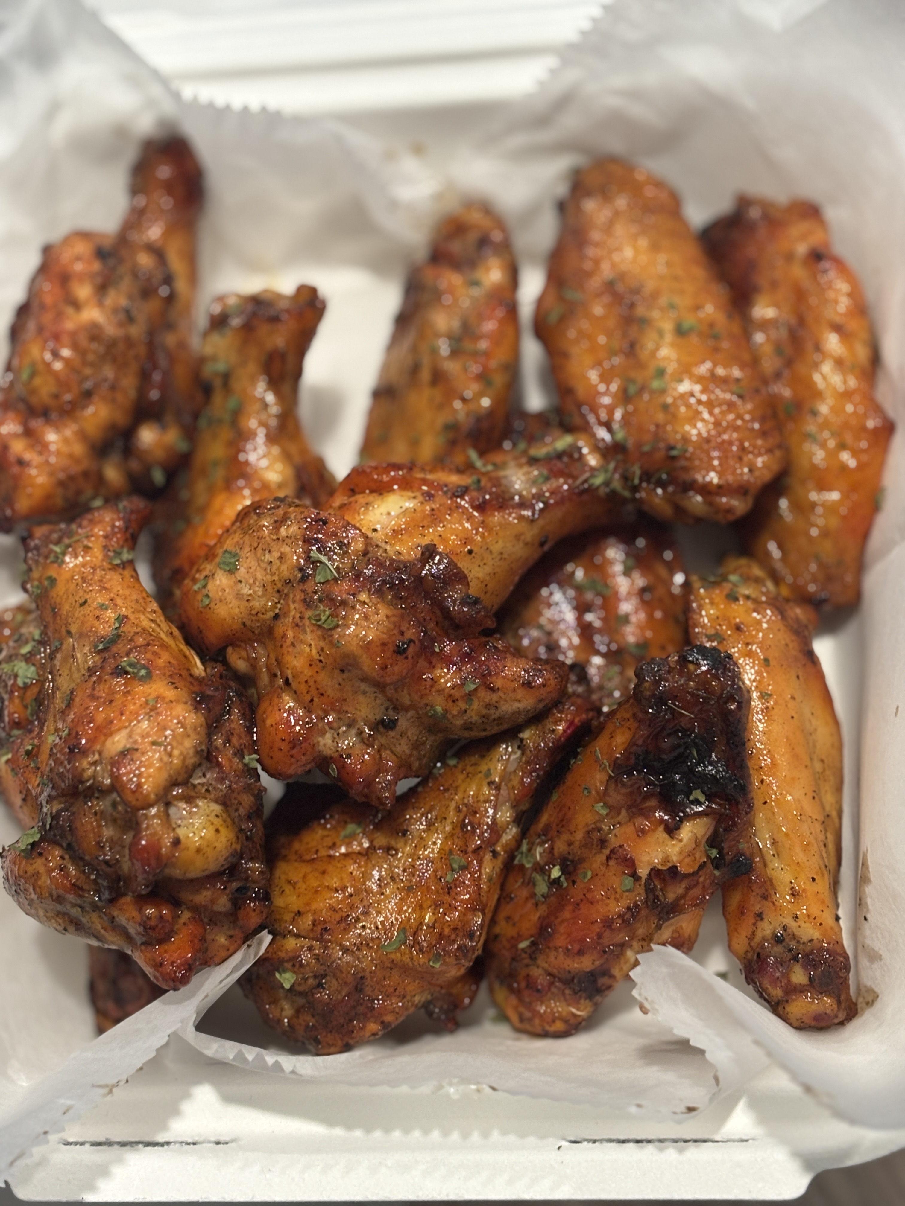 Deeply smoked wings with a mahogany crust