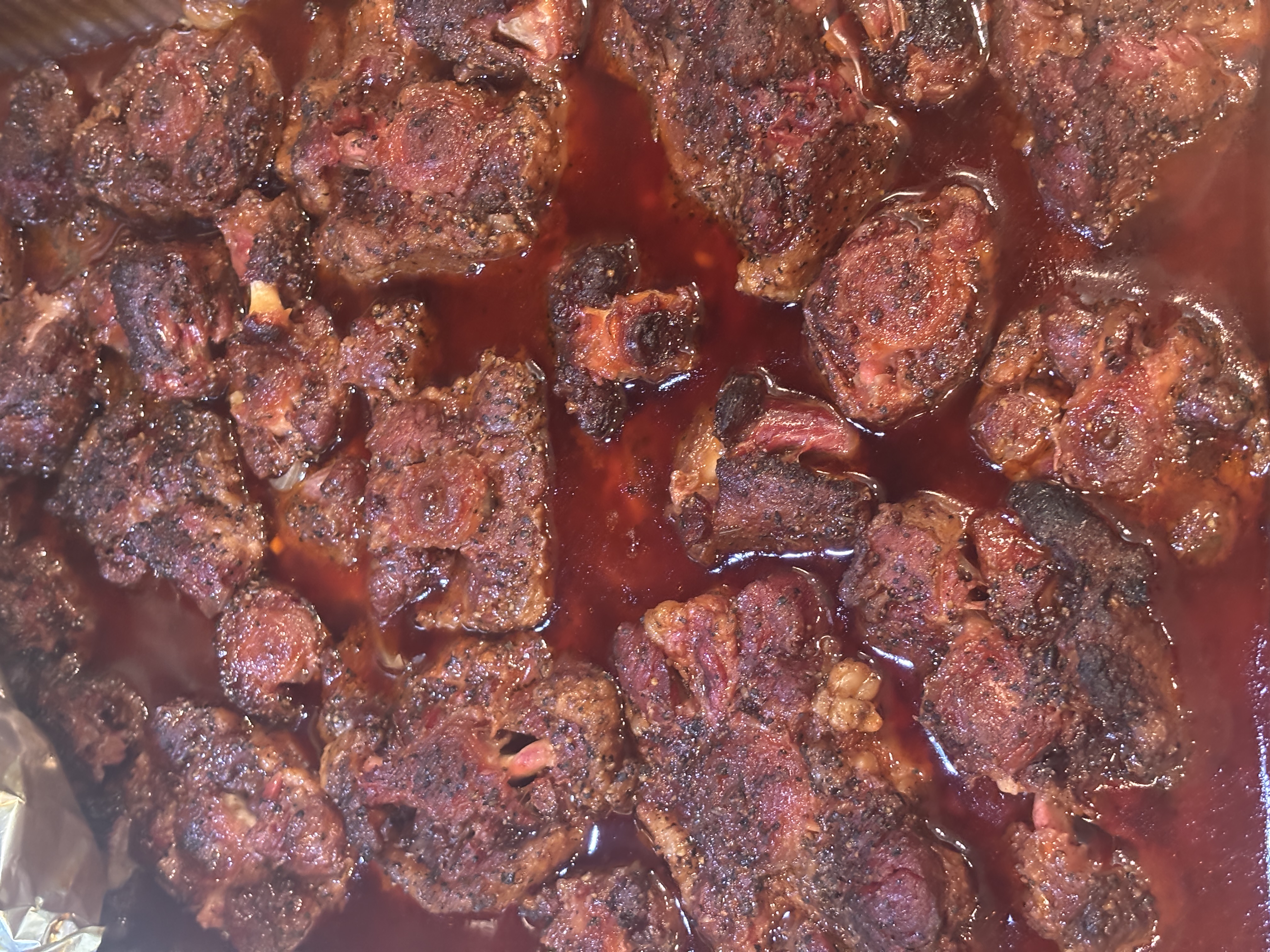 Pile of smoked rib tips fresh off the grill